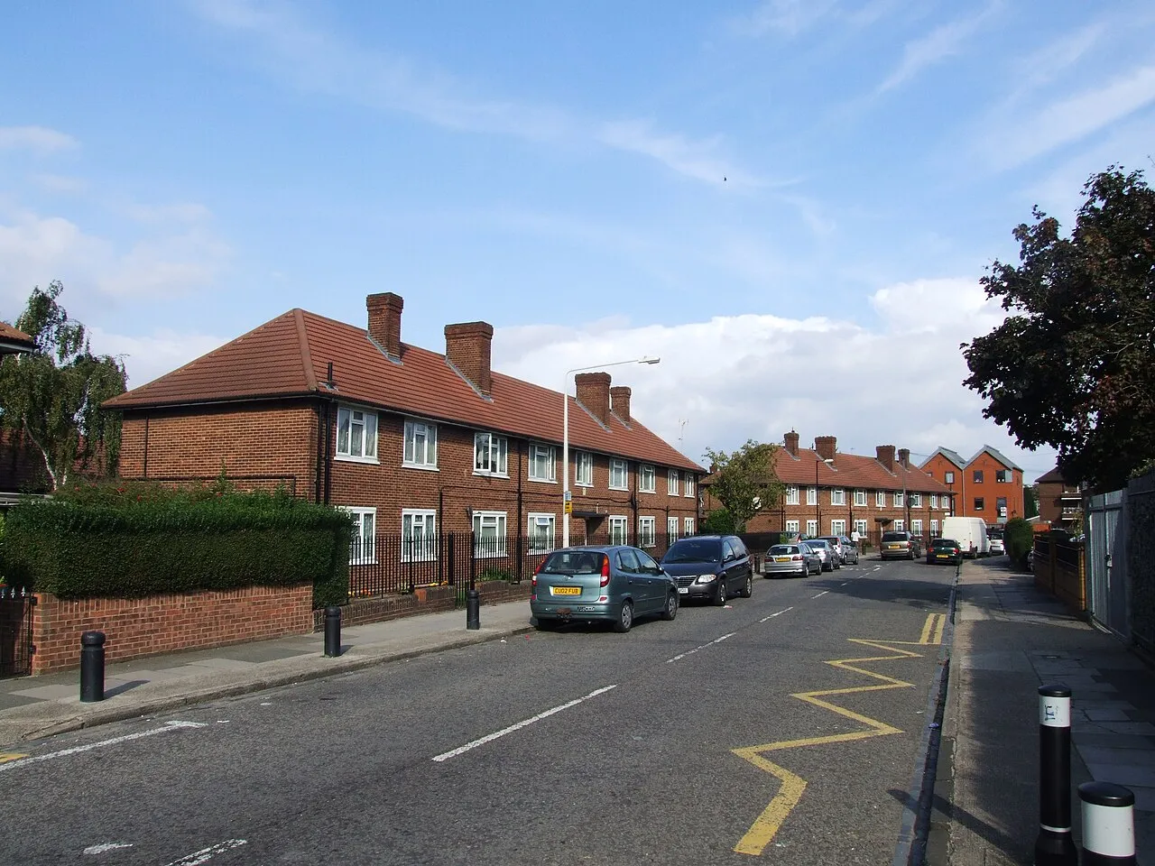 Red-brick terraced houses on a quiet road in Canning Town, East London